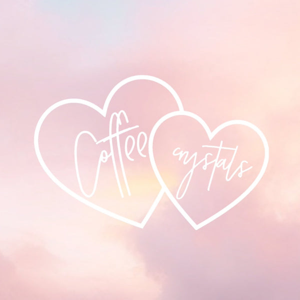 pink sunset sky background with a white overlay image of two overlapped hearts, one heart says coffee, the other says crystals