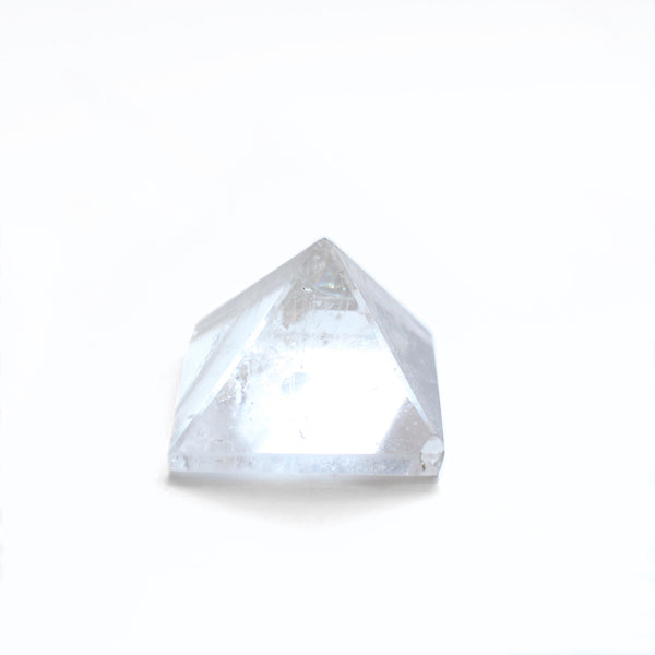 1.5 - 2 inch wide clear quartz pyramid. photo is taken from the front view, with a white background