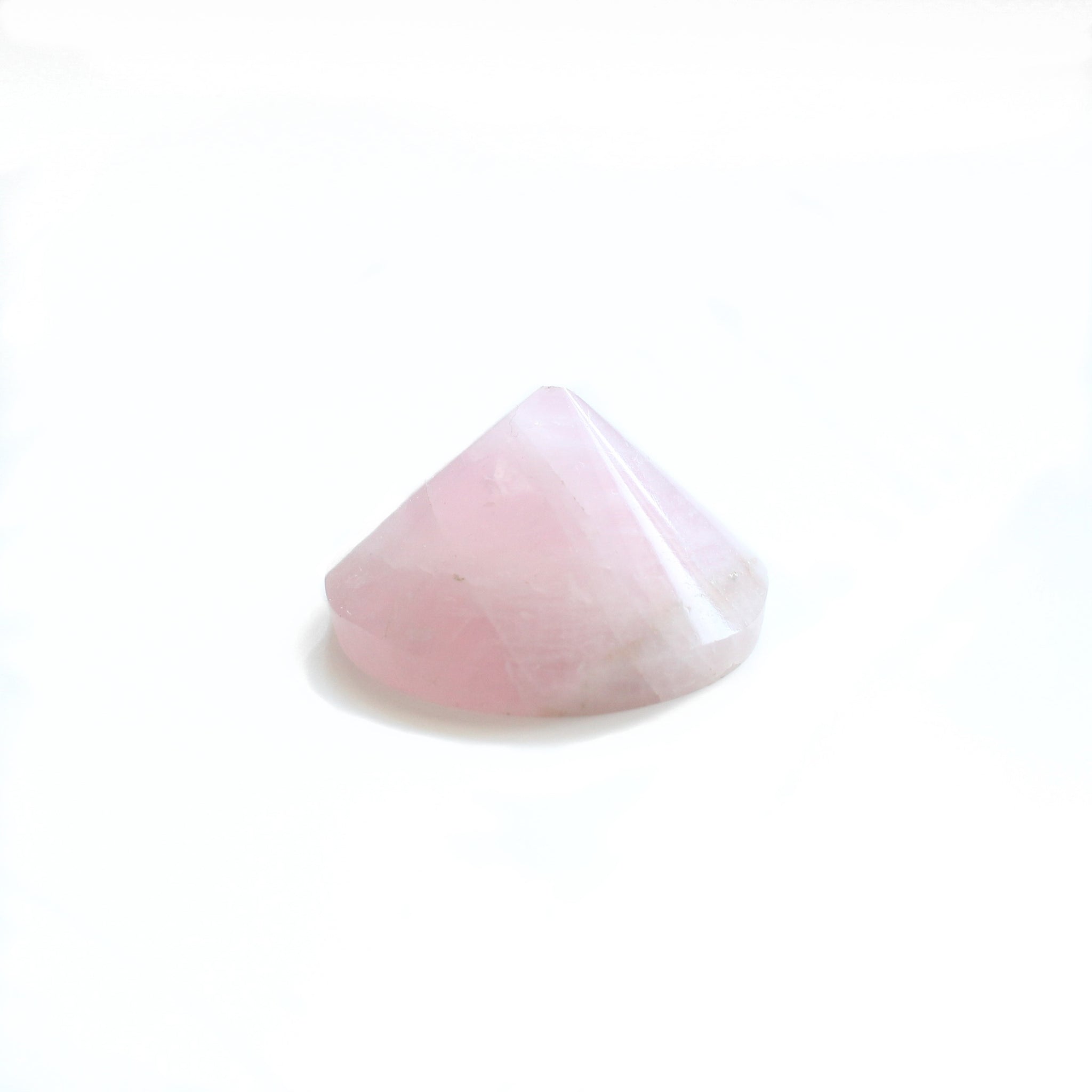 1.5 - 2 inch diameter cone shaped rose quartz specimen. photo is taken from the front angle, with a white background