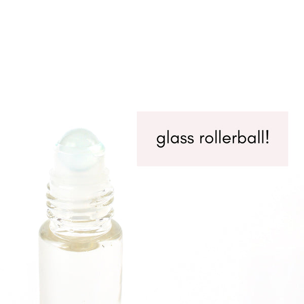 clear glad roller bottle, close up of the frosted glass roller ball. white background