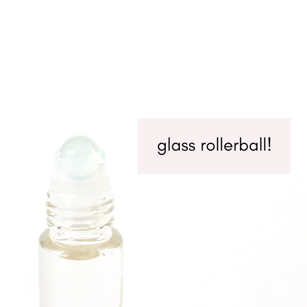 white background with a close up image of a glass rollerball with a frosted glass ball on top