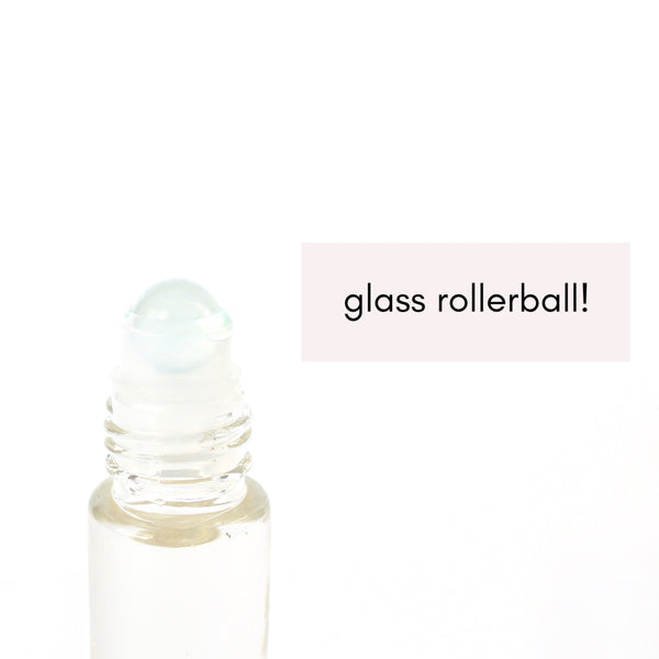 clear glass roller bottle with a close of of the frosted glass roller ball.