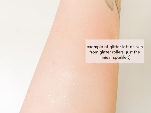 causasian arm swatching the oil roller, showing that the glitter left on your skin is very subtle
