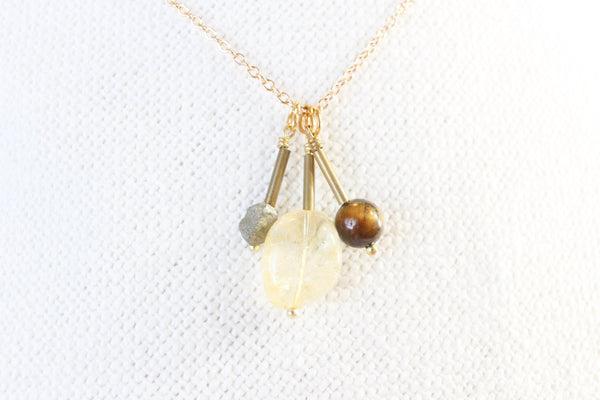 tigers eye, citrine, and pyrite pendants with gold brass detail, strung on a dainty gold chain