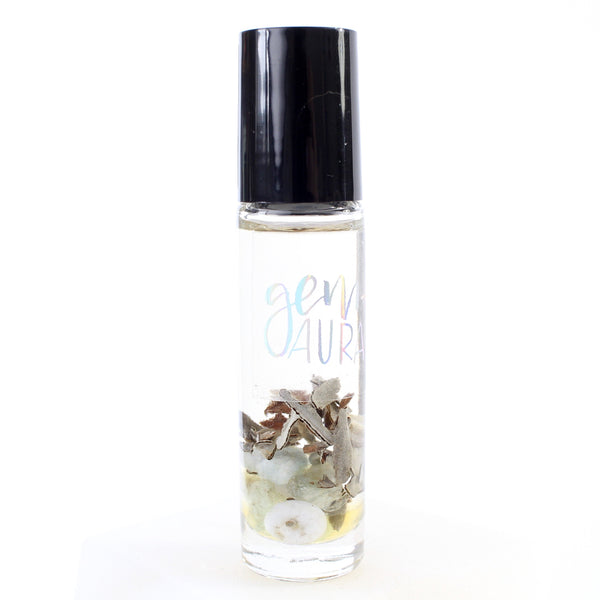clear glass oil roller bottle with a black lid. it has a holographic gem and aura label on it. the bottle is full of oil, and inside is dried sage, aquamarine, blue lace agate and clear quartz chips. white background.