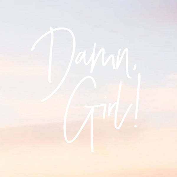 soft faded background of a sky at sunset, with a white mock up  of a decal that says "Damn, Girl!" in hand lettered font