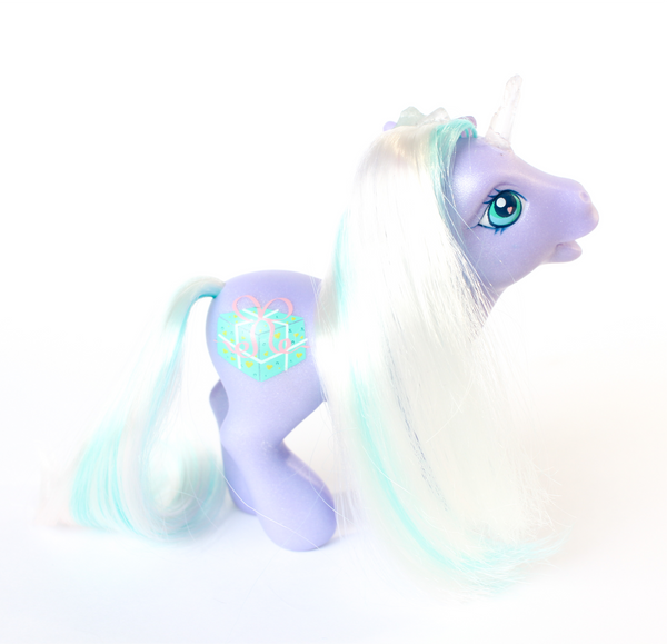 shimmery purple My Little Pony figurine with white and teal hair. side profile, hair side. pony has been altered and has had a quartz horn attached, and multiple blue, clear and purple crystals along the main. pony's cutiemark on hind quarters is a teal present wrapped with a pink bow. white background.